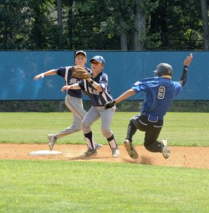 Asa Smith (9) slides into second base. (Photo by 