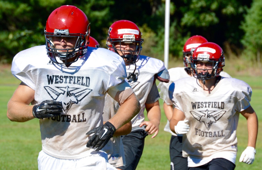 The Bombers run to their next drill during a practice session Tuesday at Westfield High School. (Photo by Chris Putz)