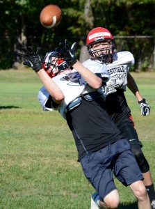This Bomber makes a tough over-the-shoulder catch (yes, he completed the catch) at Tuesday's football practice. (Photo by Chris Putz)