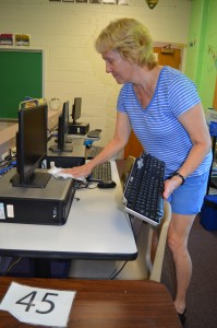 Lisa Korzenecki, a fourth grade teacher at the Southampton Road Elementary School in Westfield, dusts off the computers in her classroom.