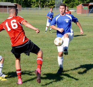 Gateway (blue jerseys) battled Hampshire Regional (red) Monday in the first of three scrimmages scheduled for the Gators' boys' soccer team this week. (Photo by Chris Putz)