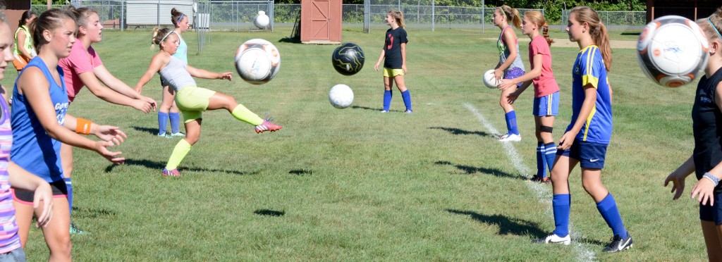 Gateway girls’ soccer players participate in a drill Monday. (Photo by Chris Putz)