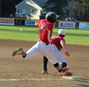 Janesville, WIsconsin’s Tegan Christiansen attempts to beat out a throw to Bismarck (North Dakota) first baseman Mason Leingang Saturday in a Babe Ruth Baseball 14-Year-Old World Series game at Bullens Field. (Photo by Kellie Adam)