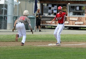Jack Grant quickly dives back to third base in order to avoid the tag. (Photo by Kellie Adam)