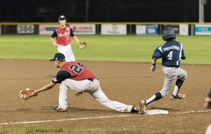 Westfield first baseman Josh Lis (24) attempts to stretch out to make this play as Portland's Henry Westphal runs past the first base bag. (Photo by Marc St. Onge)