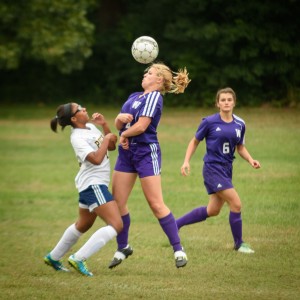  Liza Lapko heads the ball away from a Putnam defender while Tatyana Kirpicheva backs her up Wednesday at Hubbard Park in Springfield. (Photo by Marc St. Onge)