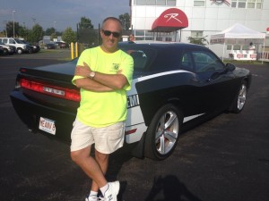 Adam Wright is chairing the Westfield Kiwanis Car Show & Fly-In at Westfield-Barnes Regional Airport. He is seen with his 2010  Dodge Challenger STR8 with 450 horsepower. (Submitted photo).