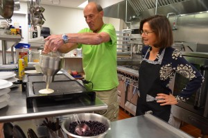 Dr. Alice Bonner, secretary of the Executive Office of Elder Affairs for the Commonwealth of Massachusetts, helped in the kitchen Friday morning as Alan Sudentas served the last of the pancakes for a fundraiser breakfast.