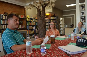 Peter Glidden, Ph.D., reads from a writing exercise at the Westfield Writers' Project as Shavonne Paroline and Gayle Gray listen intently. Gray launched the new group Sept. 17.