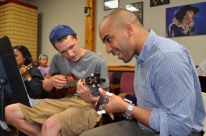 Jason Bilodeau and Andrew Renfro compared notes during the first meeting of the Whip City Ukesters.