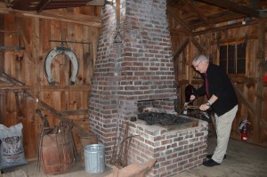 Bob McKean, managing director at Stanley Park, is seen inside the blacksmith shop next to the pond.