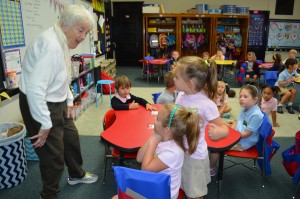 Twins Stella (sitting) and Charlotte Salls chat with Sister Jane Morrissey, SSJ, in Jen Daley's classroom at St. Mary's Elementary School in Westfield.