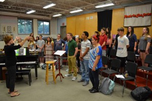 Korey Bruno, director of choral activities at Westfield High School, rehearses songs from "Phantom of the Opera" with students on Friday morning.