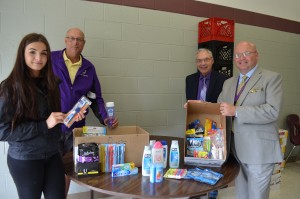 Westfield Technical Academy senior Tanya Gonchuk is joined by Ward 2 city councilor Ralph Figy, Henry Bannish of the Conservation Commission, and Tech principal Joseph Langone during a food drive on Friday. In addition to nonperishable food items, city residents also dropped off toiletries and school supplies.