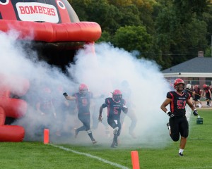 The Westfield Bombers roar out of the tunnel to begin the 2016 high school football season Friday night at Bullens Field. The Bombers rolled over the Hoosac Valley Hurricanes, 54-22. (Photo by Marc St. Onge)