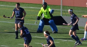 Alexa Whitney (13), Megan Fountaine (32) and Rachel Testa (2) defend against Keene State. Fountaine made 16 saves with Whitney earning three defensive saves. (Photo courtesy of Westfield State University Sports)