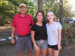 WTA cross country coach Ralph Figy with sophomores Jenessa Seymour and Jordyn Cole at practice on Friday in Stanley Park. (Photo by Amy Porter)