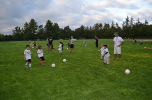 Westfield Parks and Recreation Coach Jeff Sarat reviews rules of kicking a soccer ball prior to a Pee Wee soccer game.