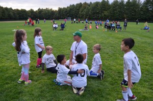 Westfield Parks and Rec coach Jeff Sarat rallies his team before a match.