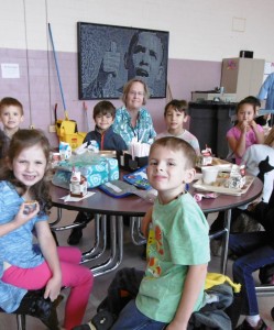 Franklin Avenue principal Frances St. Peter sits with some first graders at lunch on Friday. (Photo by Amy Porter)