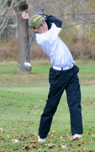 Matthew Garrity follows through on a swing for Southwick on the 15th hole. (Photo by Chris Putz)