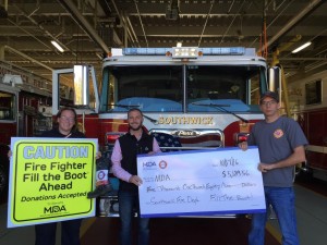 Will Southall presented the Southwick Fire Department with the check in result of their efforts from the Fill the Boot Drive fundraising that goes towards the MDA. (Photo by Greg Fitzpatrick)