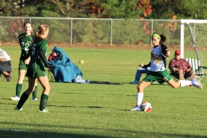 St. Mary's Allie Goodreau (20) kicks the ball against McCann Tech. (Photo by Kellie Adam) 