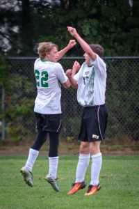 Saints' Matt Masciadrelli and Kevin Rockwal celebrate a goal by the St. Mary boys' soccer team Tuesday. The home team went on to defeat the visiting Pathfinder Pioneers 3-0 at Westfield Middle School North. (Photo by Marc St. Onge)