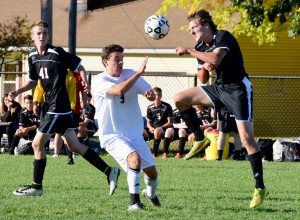Westfield’s Mitch Weiss, right, drills a header as a Longmeadow player looks on during a regular season contest. The two teams will meet again to begin the postseason. (Photo by Chris Putz)