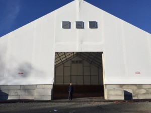 DPW Director Randy Brown stands under the new salt shed that is 80 by 100 ft. (Photo by Greg Fitzpatrick)