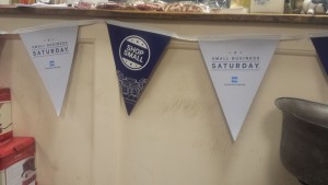 Small Business Saturday banners hang at Whip City Candle
