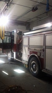 The fire apparatus inside the vehicle bay of the new station