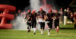 The Westfield Bombers emerge from a tunnel of smoke during a regular season home game. Westfield kicks off an exciting weekend of high school championship action. (Staff photo)