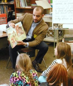 Drew Renfro, Sen. Don Humason's chief of staff, read the story of a slave poet at Highland Elementary. (Photo by Amy Porter)