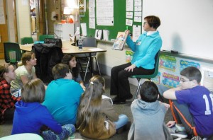 Retired librarian Estelle Streeter read to fourth graders at Paper Mill. (Photo by Amy Porter)