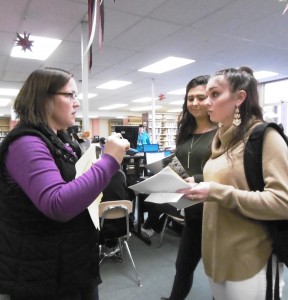 Guidance counselor Kristen Puleo helps Courtney Fiddler and Jenna Edgley. (Photo by Amy Porter)