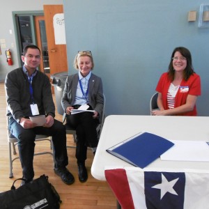 International observers Jorg Lehnert of Germany and Evelyn Hutson-Hartmann of Switzerland speak with Huntington election clerk Kathy Thomas during voting in Stanton Hall. (Photo by Amy Porter)