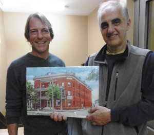 Architect Jeffrey Scott Penn and Joseph Shibley, owner of the Bismark Hotel building with a rendering of the refurbished porches. (Photo by Amy Porter)