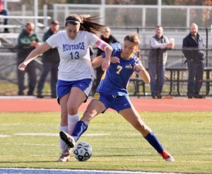 Gateway's Ava Auclair (7) and Monson's Bryanna Murphy battle for possession of the ball during the girls' soccer Division 4 West Sectional championship Saturday at Westfield State University. (Photo by Marc St. Onge)