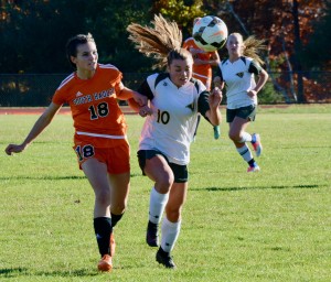Southwick’s Lydia Kinsman, right, attempts to get out ahead of South Hadley’s Sarah Fudger during a West Division 3 girls’ soccer quarterfinal game Monday. (Photo by Chris Putz)