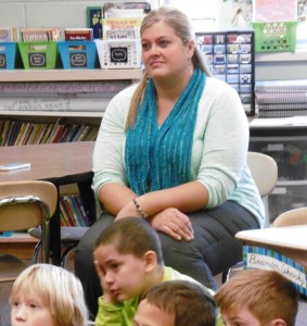 Munger Hill third grade teacher Christy Roselli listens with students. (Photo by Amy Porter)