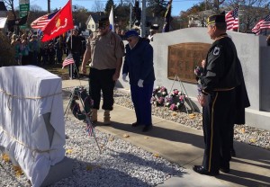 Southwick Gold Star Mothers Mrs. Marie Alamed and Mrs. Shirley O'Dell place wreaths near the memorial stone. (Photo by Greg Fitzpatrick)