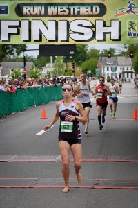 Runners cross the finish line during the 2016 Run Westfield Flat Fast 5K Road Race. (Staff Photo)