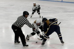 Lauren Munster takes the faceoff for Longmeadow (WHS Co-Op) in a girls' ice hockey game Saturday against Shrewsbury at the Olympia Ice Center in West Springfield. (Photo by Bill Deren)