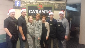 Members of Carando and the 104th National Guard pose during the event Dec. 20