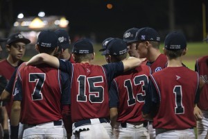 Ballplayers for the Westfield Babe Ruth Baseball 14-Year-Old All-Stars huddle together on Opening Night of the World Series at Bullens Field. (Staff Photo)