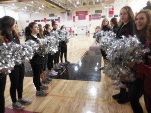 Dougherty entered the gymnasium through a line of Bomber's cheerleaders. (Photo by Amy Porter)