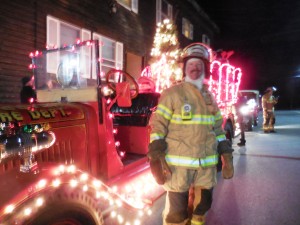 Chester Fire Chief Rich Small stands next to the town's 1927 American LaFrance Engine.