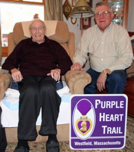 Raymond "Charlie" Goyette (right) and Scott Thomas (left) pose with the Purple Heart Trail sign that will be erected soon
