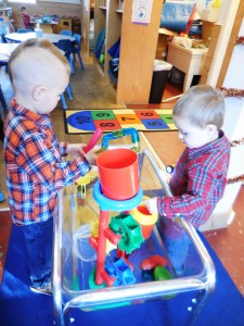 Russell brothers Jimmy and Johnny Wright busy at play in the Hilltown Family Center. (Photo by Amy Porter)